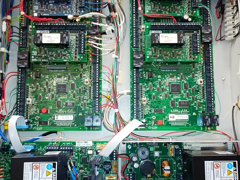 Four Mercury and LenelS2 access controller boards with dual backup batteries in a master telecom enclosure in Mississauga, ON.