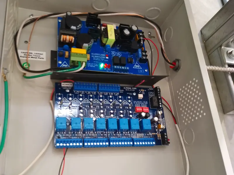 Lock power supply above a fused multi-output distribution board for electric strikes and maglocks in Etobicoke, ON.