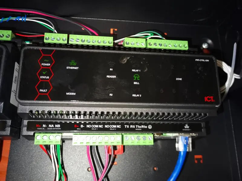 Close-up of shielded access control and intrusion conductors landed on ICT Protege DIN-rail terminal blocks in Markham, ON.